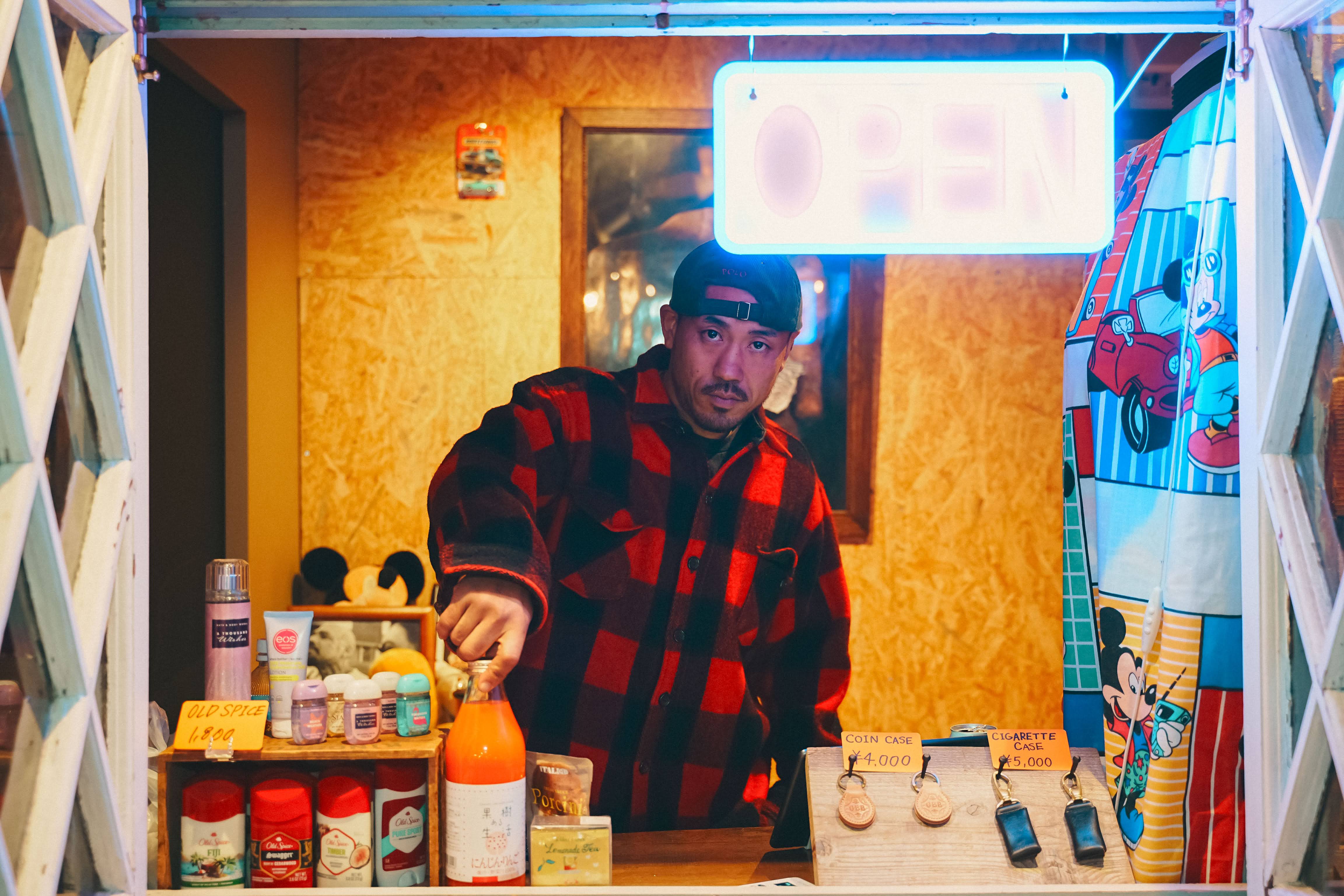 GBB neon sign with guest on velvet sofa